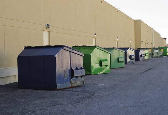 metal waste containers sit at a busy construction site in Brentwood, NY